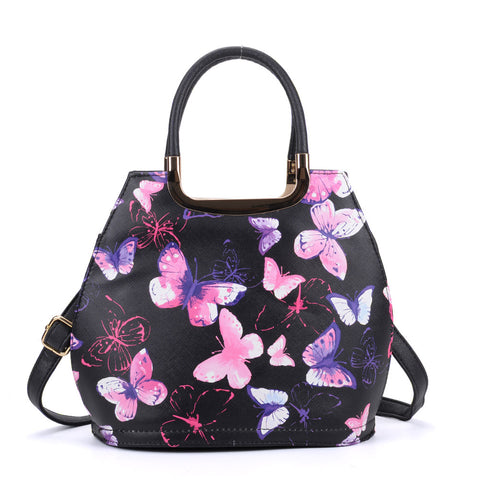 Butterfly handbag with metal accents