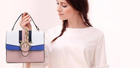 Handbag with gold chain and bird detail